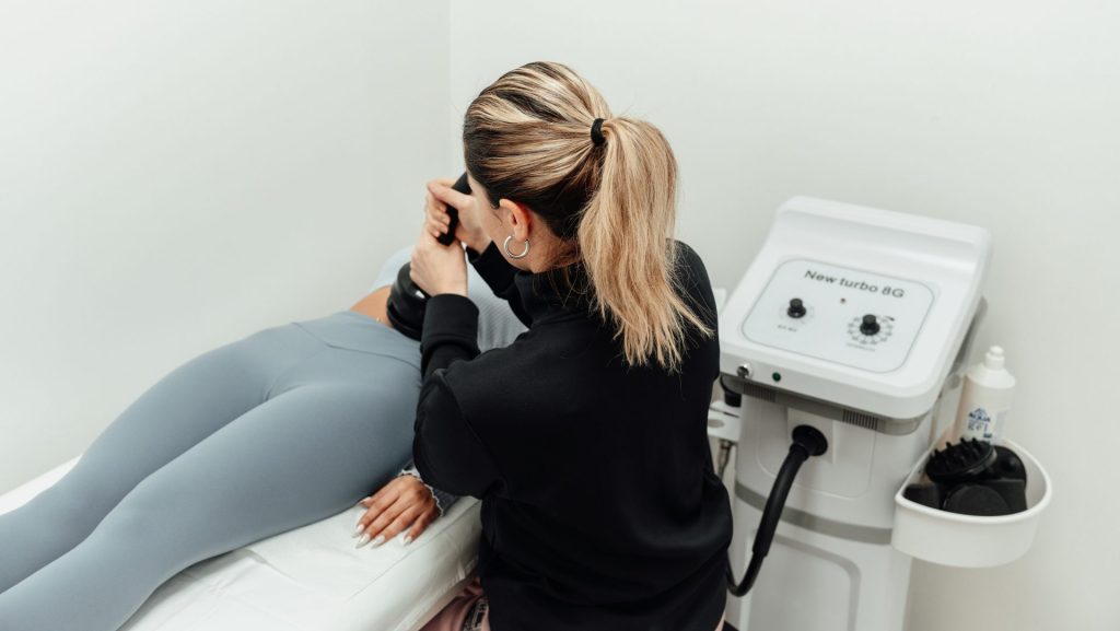 a woman getting her leg examined by a doctor